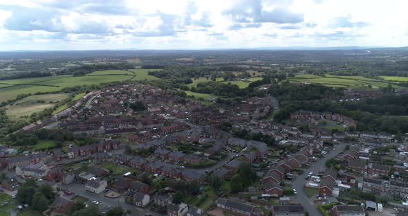 Left to right aerial shot of town near Wrexham, Wales