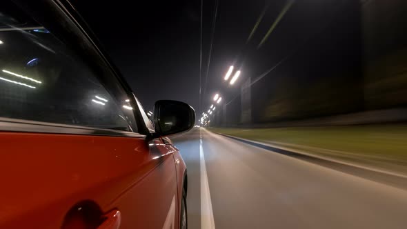 Drivelapse Urban Look From Fast Driving Car at a Night Avenue in a City Timelapse Hyperlapse