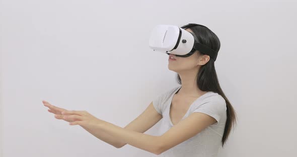 Woman play game with VR device