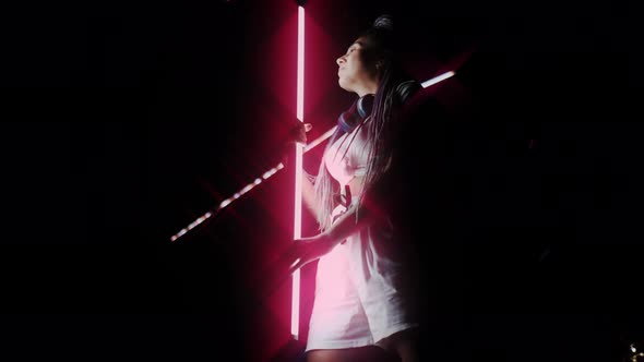 Beautiful Young Lady Holding Glowing Light Tube