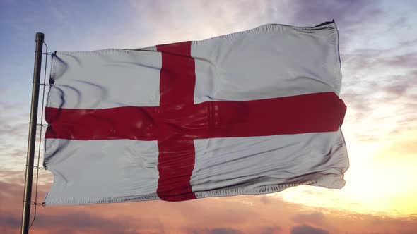 Flag of England Waving in the Wind Against Deep Beautiful Sky at Sunset