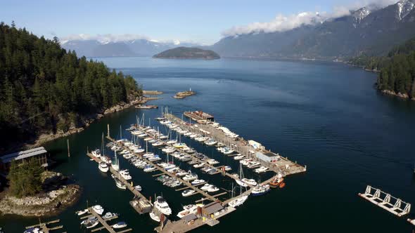 Boats Parked At The Harbor In Horseshoe Bay, West Vancouver, British Columbia, Canada. Aerial Pullba