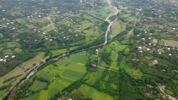Green Village And River Valley Aerial