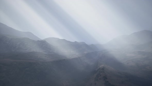 Sun Rays Against the Backdrop of the Mountains