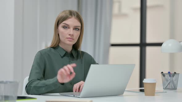 No Gesture with Finger By Young Woman at Work 