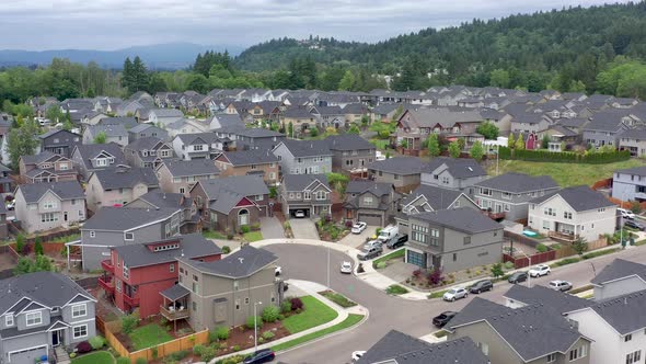 Aerial view orbit of newly constructed houses in a subdivision middle class neighborhood.