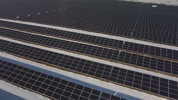 Aerial Perspective Solar Panel Farm Green Energy at Winter Snow Sunny Day Drone Shot of Ecology