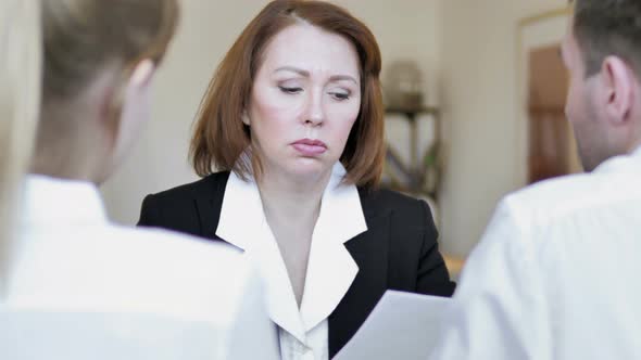 Senior Businesswoman Talking with Client