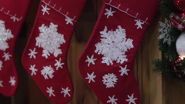 Panning across christmas stockings on mantle