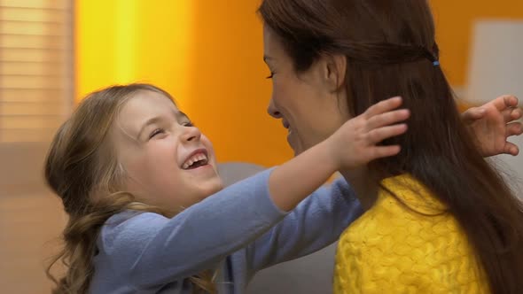 Adorable Laughing Girl Hugging Happy Mommy, Tender Family Relations, Slow Motion