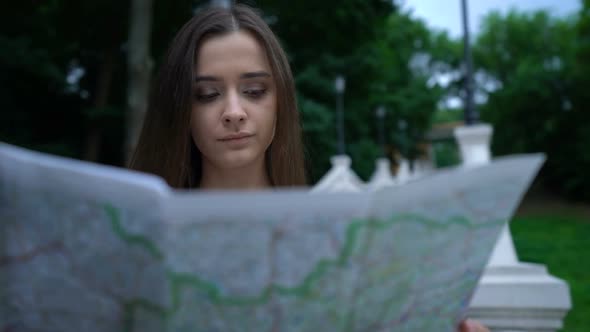 Pretty Woman Using Map to Find Historical Attraction, City Tour, New Impressions