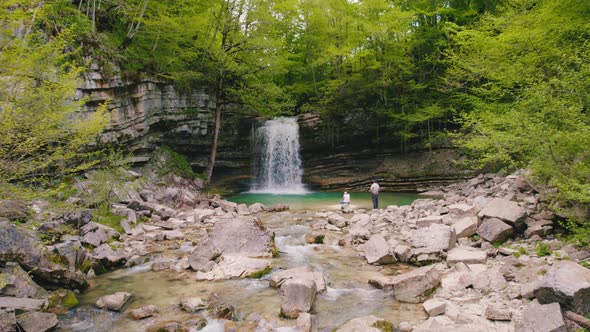 Panorama of a Small Waterfall and a Cascade on Huge Rocky Ledges