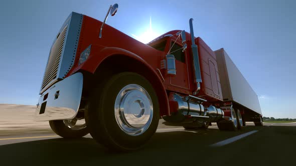 Huge semi-trailer cargo truck riding on the highway. Wheel closeup. Loopable. HD