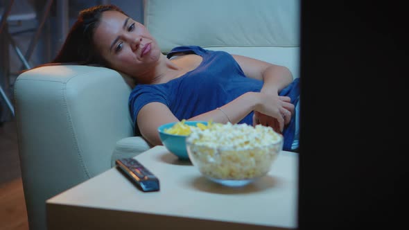 Exhausted Woman Watching Tv Show