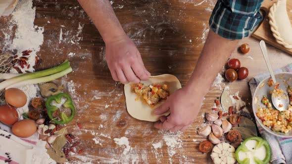 Man Cooking Empanadas Argetinian Pie Traditional Bakery From Argentina Chef Filling Dough in Home