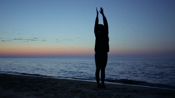 Unknown Sporty Girl Training on Beach Late Evening