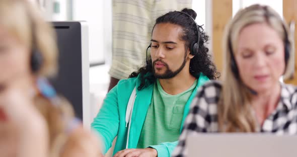 Call centre staff working in a modern office