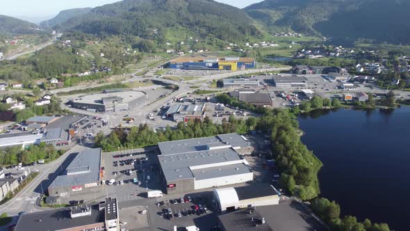 Reverse aerial of Asane district with IKEA among other mall and shops - High altitude aerial overvie