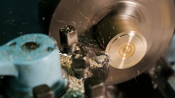 Turning Lathe in action.Facing Operation of a Brass Blank on Turning Machine with Cutting tool