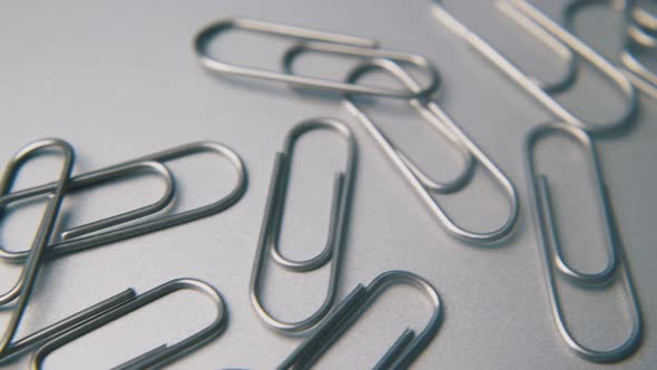 Pile of Paperclips for School and Office on Grey Background