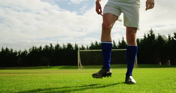 Football player juggling a ball