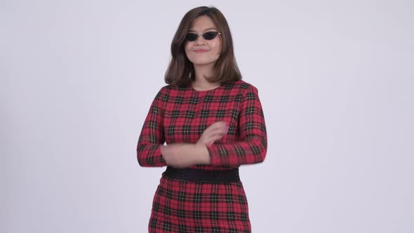 Young Happy Asian Businesswoman Smiling with Arms Crossed