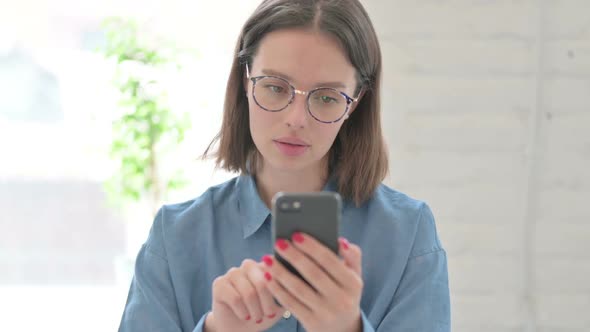 Young Woman using Smartphone