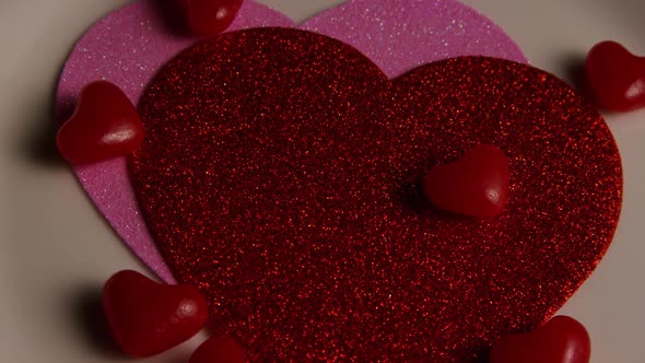 Rotating stock footage shot of Valentines decorations and candies - VALENTINES 0110