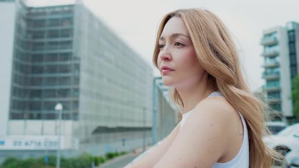 Slow motion young woman posing outdoor confident contemplating believing future