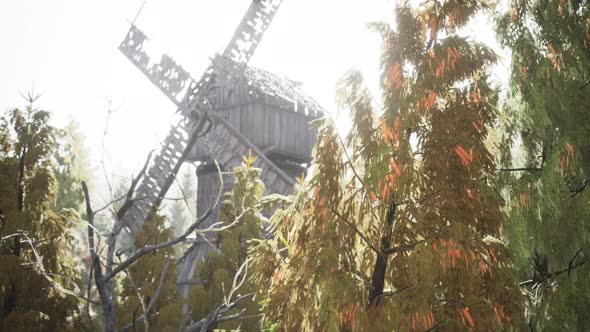 Old Traditional Wooden Windmill in the Forest alt