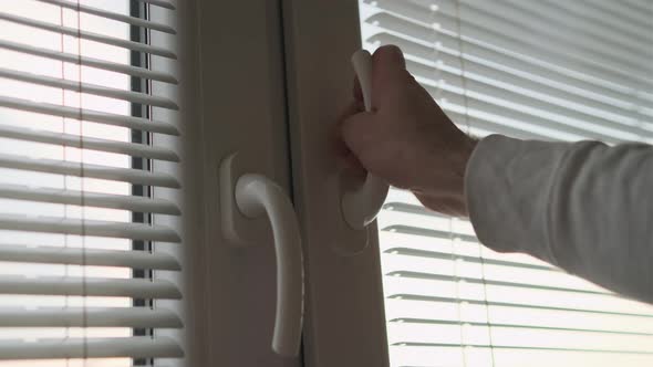 Close Up Man Hand Closing a Window After Home Ventilation