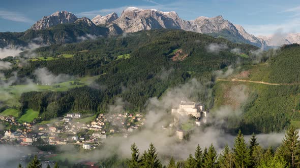 Hohenwerfen Castle in Austria. Foggy morning in Autumn Season