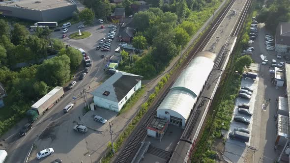 Flying Over Suburban Railway Station with Arriving Train, Russia