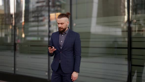 Office Clerk Lawyer or Entrepreneur is Standing on Street and Sending Message By Smartphone