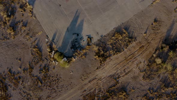 Abandoned Propellor Plane in Desert Field Aerial