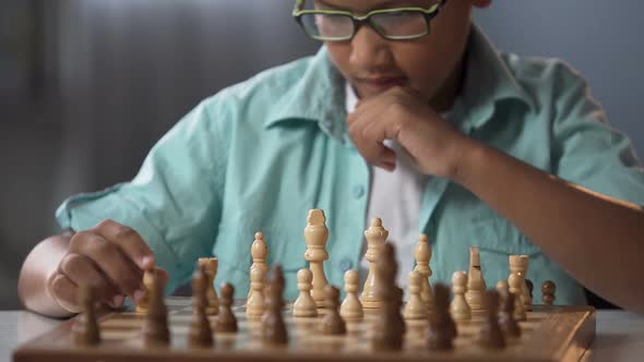 Junior Pupil Taking Part in Chess Competition Thinking Over Strategy, Hobby