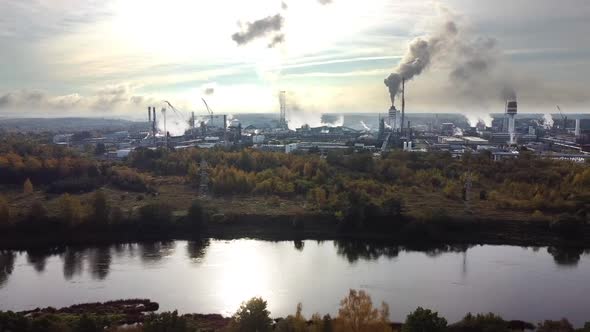 Aerial view of industrial area with chemical plant. Smoking chimney from factory. Chemistry factory