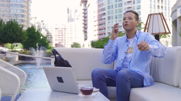 Young businessman working outside the home.