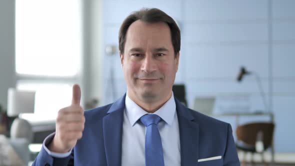 Thumbs Up By Businessman