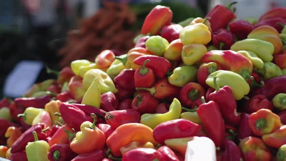 Fresh Sweet Peppers are Lying in Heap in Market