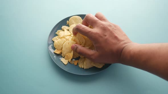 Hand Pick Chips on Plate  POV