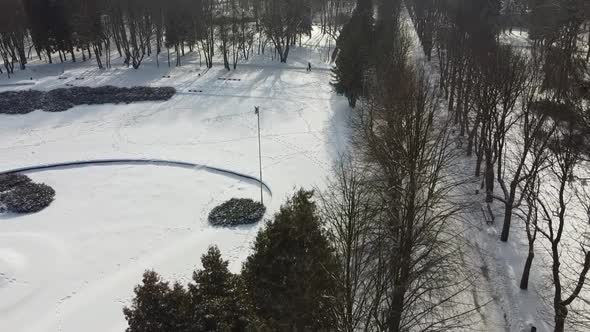 Aerial view of a drone flying over the winter park.