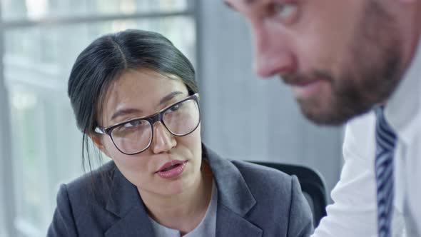 Businesswoman and Business Discussing Work