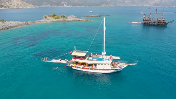 4k Aerial view of boats, Yacht in the bay sea in Fethiye Turkey, Summer vibes, Amazing turquoise sea