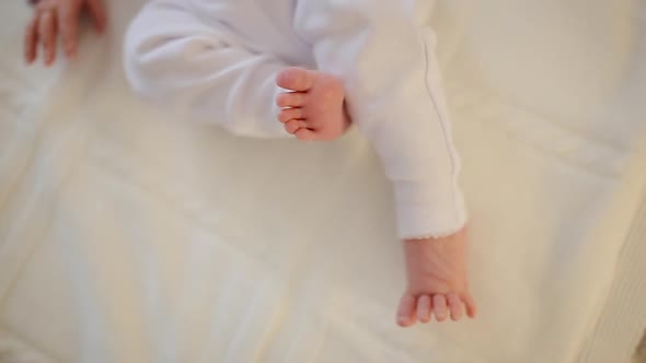 Feet of newborn baby. Funny little feet of neonatal three weeks old baby boy