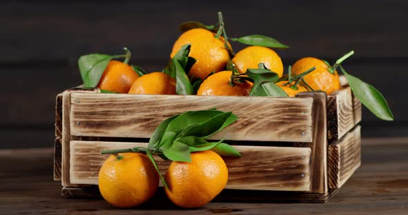Tangerines in a Wooden Box Slowly Rotate