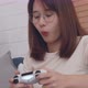 Young asian women play video game relaxing in free time sits at home - VideoHive Item for Sale