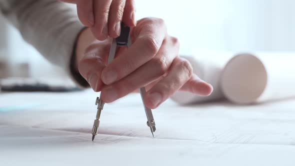 Close-up of an architect's hands. Professional real estate designer