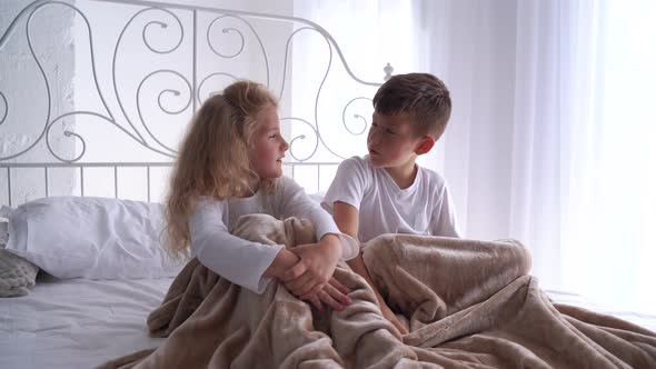 Two Children Boy and Girl Look at Each Other