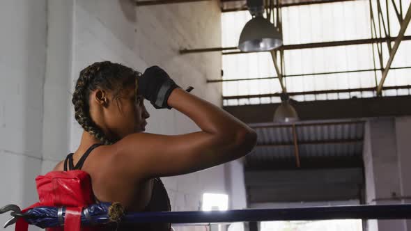 Mixed race woman resting after working out